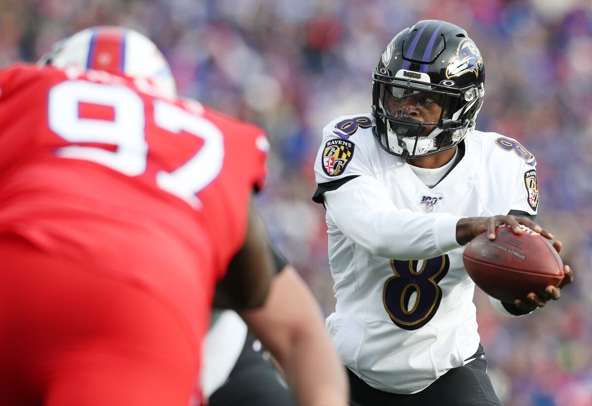 Baltimore Ravens quarterback Lamar Jackson takes a snap against the Buffalo Bills on Sunday.