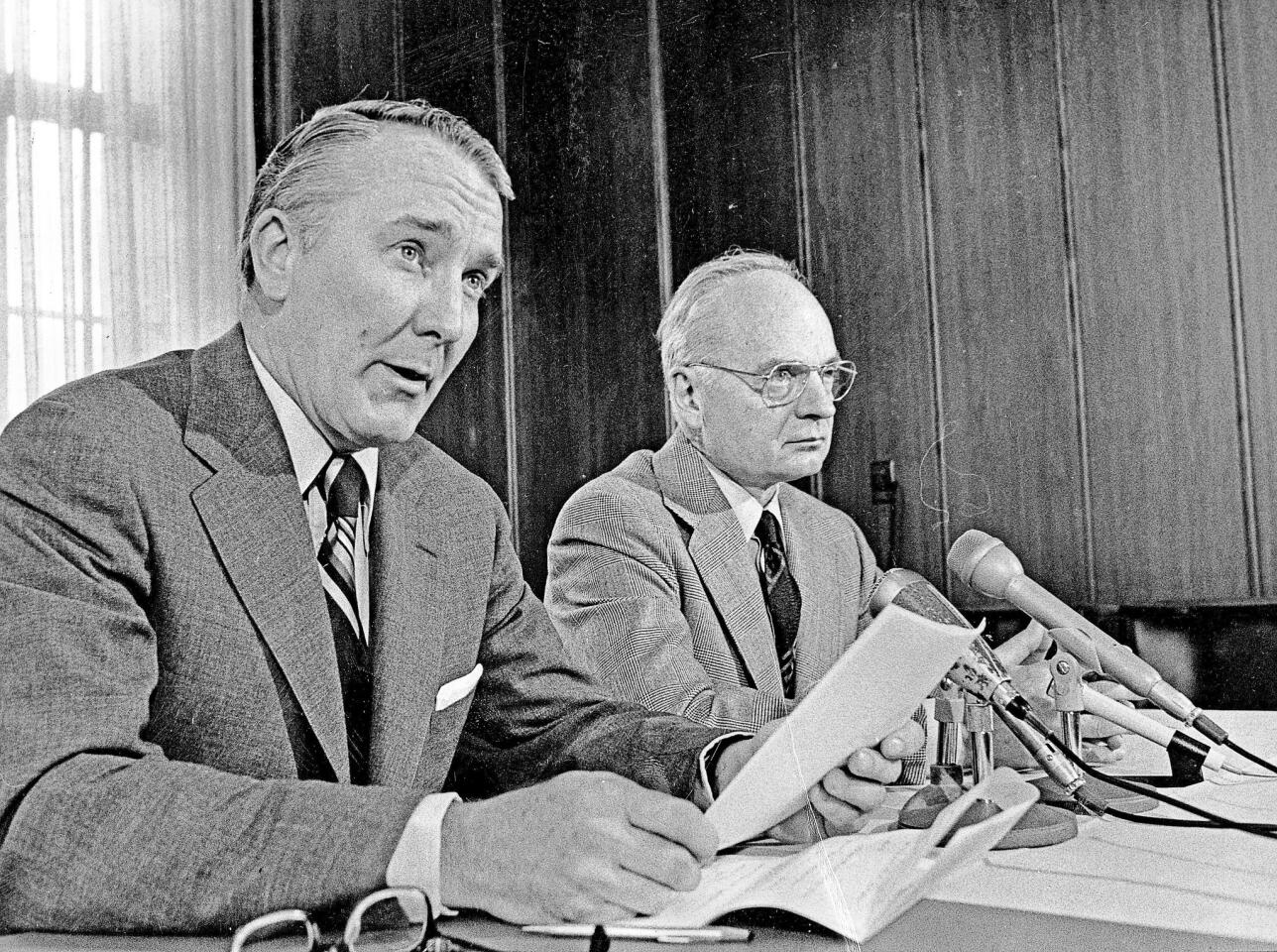 Tribune Co. CEO Stanton Cook, left, and Editor Clayton Kirkpatrick speak at an April 30, 1974, news conference on the Tribune's publication of Oval Office transcripts in the Watergate scandal. Cook, who was the newspaper's publisher, later backed an editorial that called for President Richard Nixon to resign. Cook died Sept. 3, 2015; he was 90.