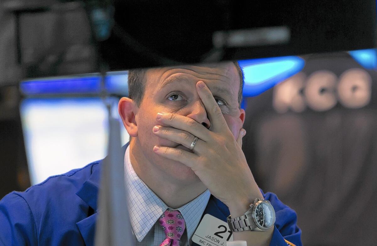 Specialist Jason Notter works on the floor of the New York Stock Exchange on Friday.