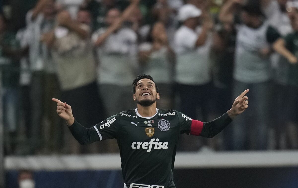 Gustavo Gomez of Brazil's Palmeiras celebrates the opening goal scored by Ze Rafael of Brazil's Palmeiras during the Recopa Sudamericana final soccer match against Brazil's Athletico Paranaense at Allianz Parque stadium in Sao Paulo, Brazil, Wednesday, March 2, 2022. (AP Photo/Andre Penner)