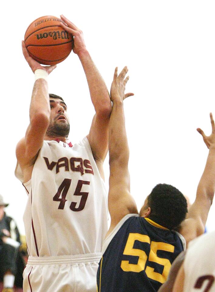 GCC's Gor Plavchyan goes up for a shot past Harbor defender Cary Brooks during a game on Friday, February 28, 2014.