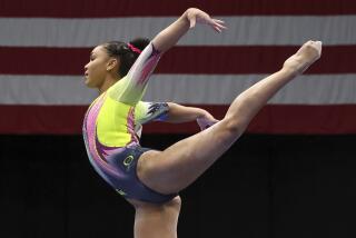 Konnor McClain competes on the beam during the U.S. Gymnastics Championships.
