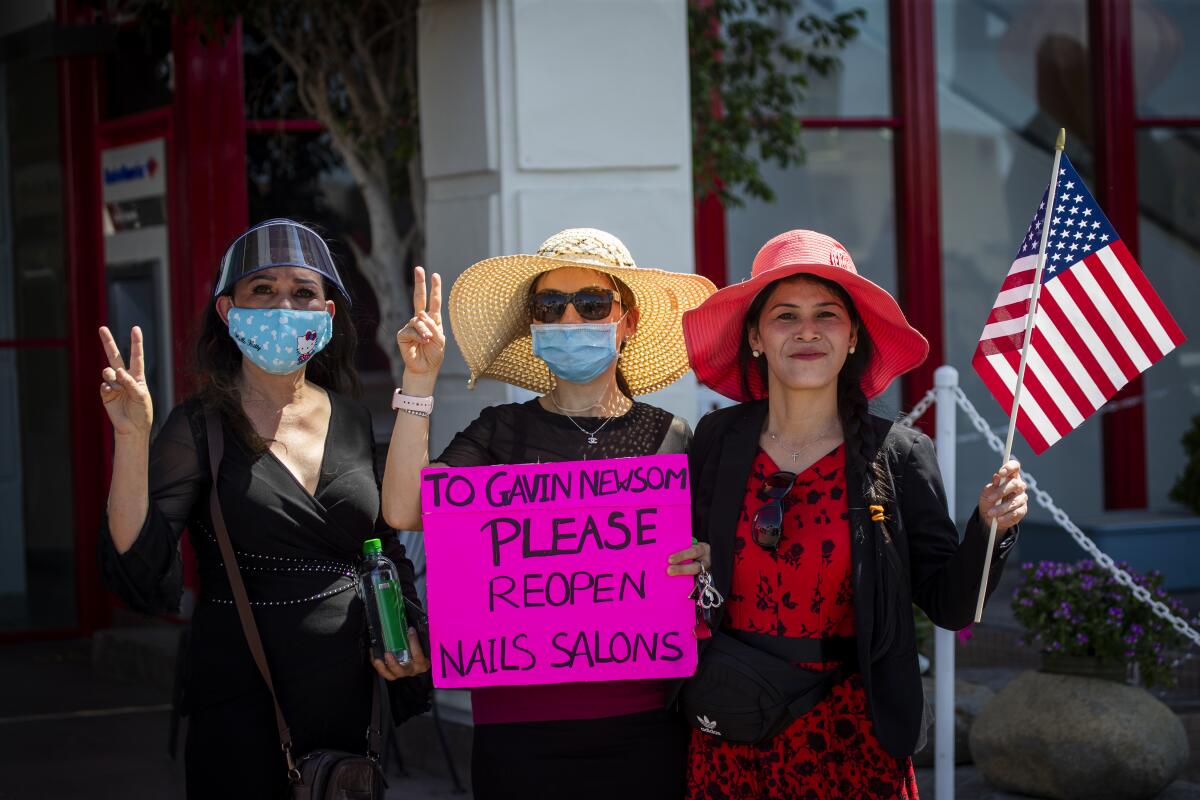 From left, salon owners Daisy Nguyen, Lisa Davis and Annie