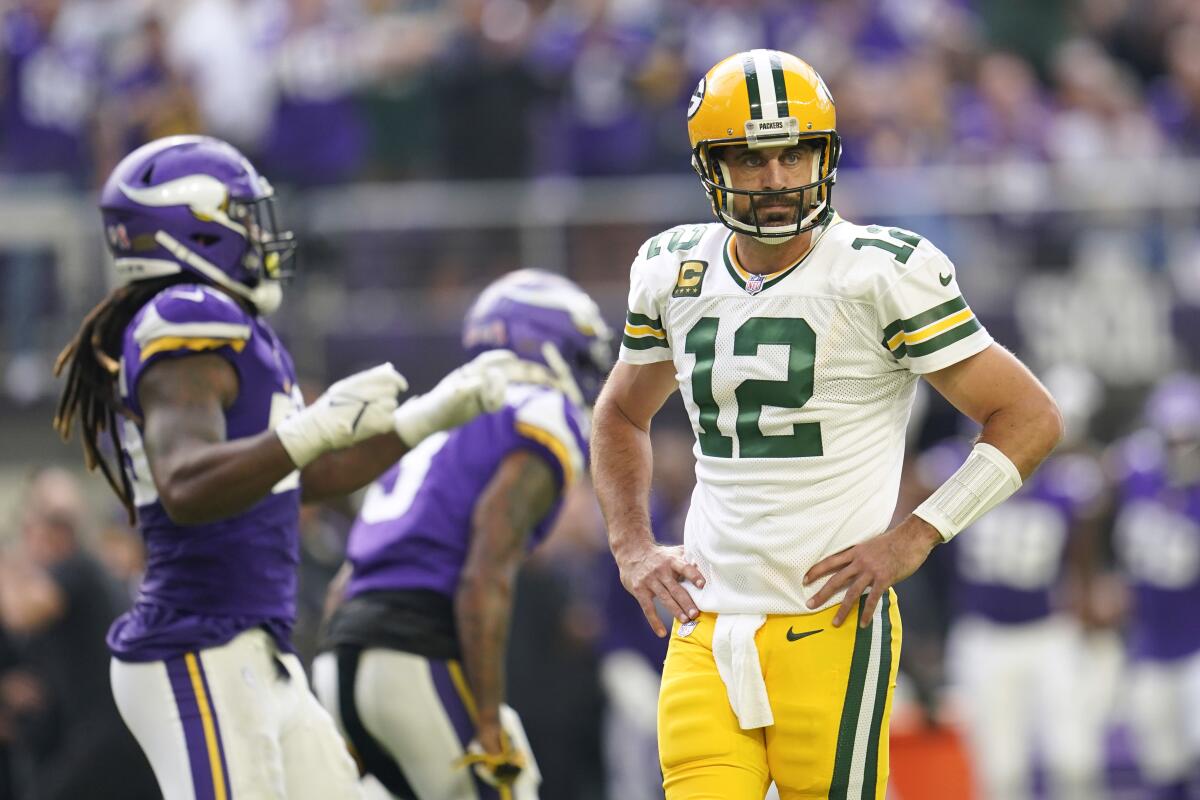 Green Bay Packers quarterback Aaron Rodgers (12) reacts after a Minnesota Vikings defensive stop on fourth down during the first half of an NFL football game, Sunday, Sept. 11, 2022, in Minneapolis. (AP Photo/Abbie Parr)