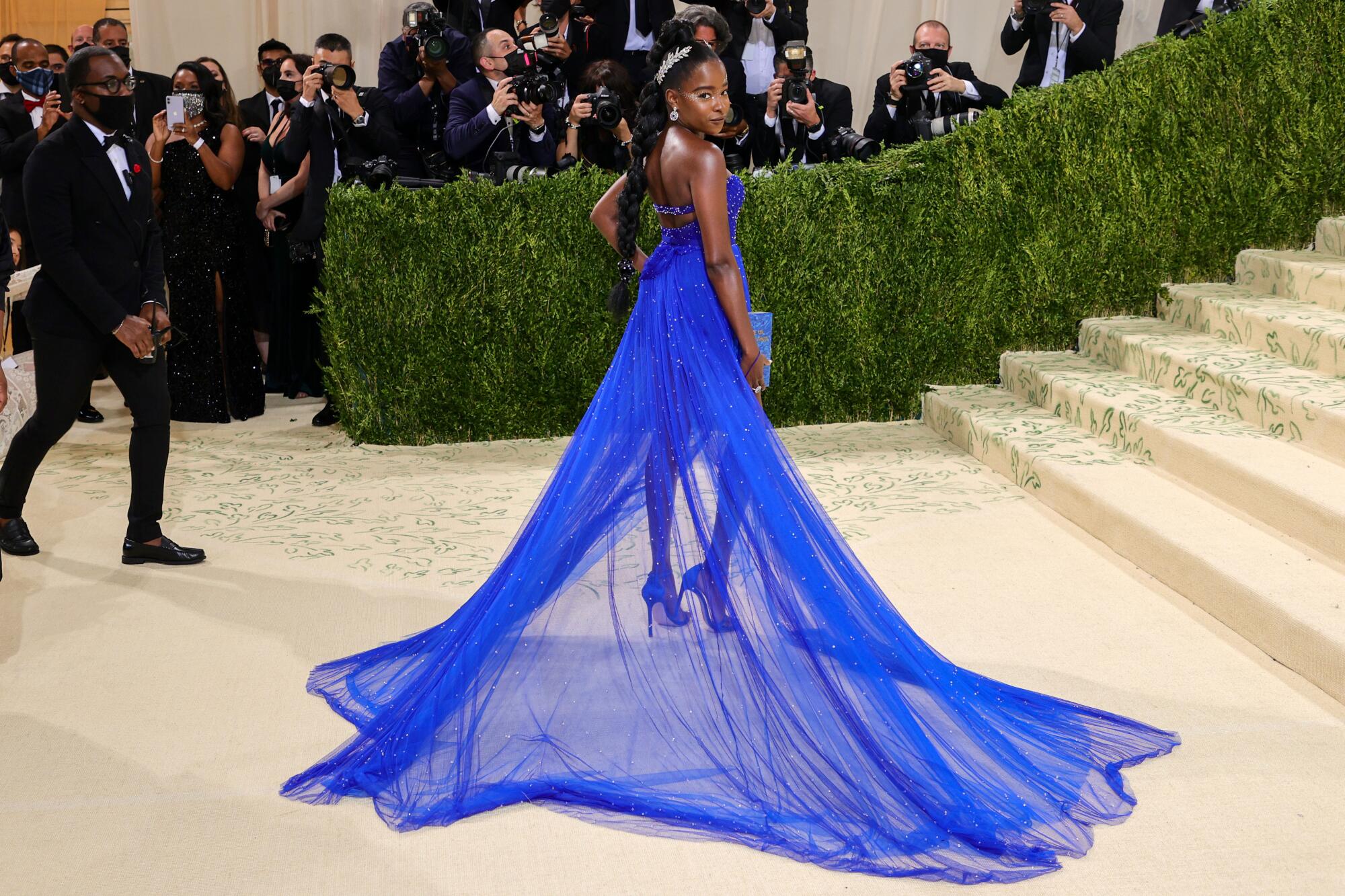 A woman wearing a blue dress.