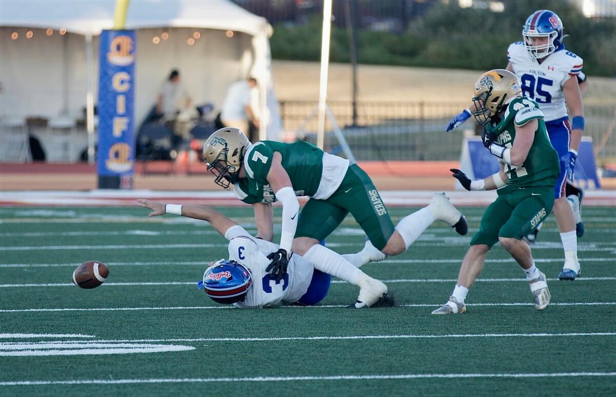 St. Bonaventure defensive end Jaden Few attempts to pounce on a fumble by Folsom quarterback Ryder Lyons.