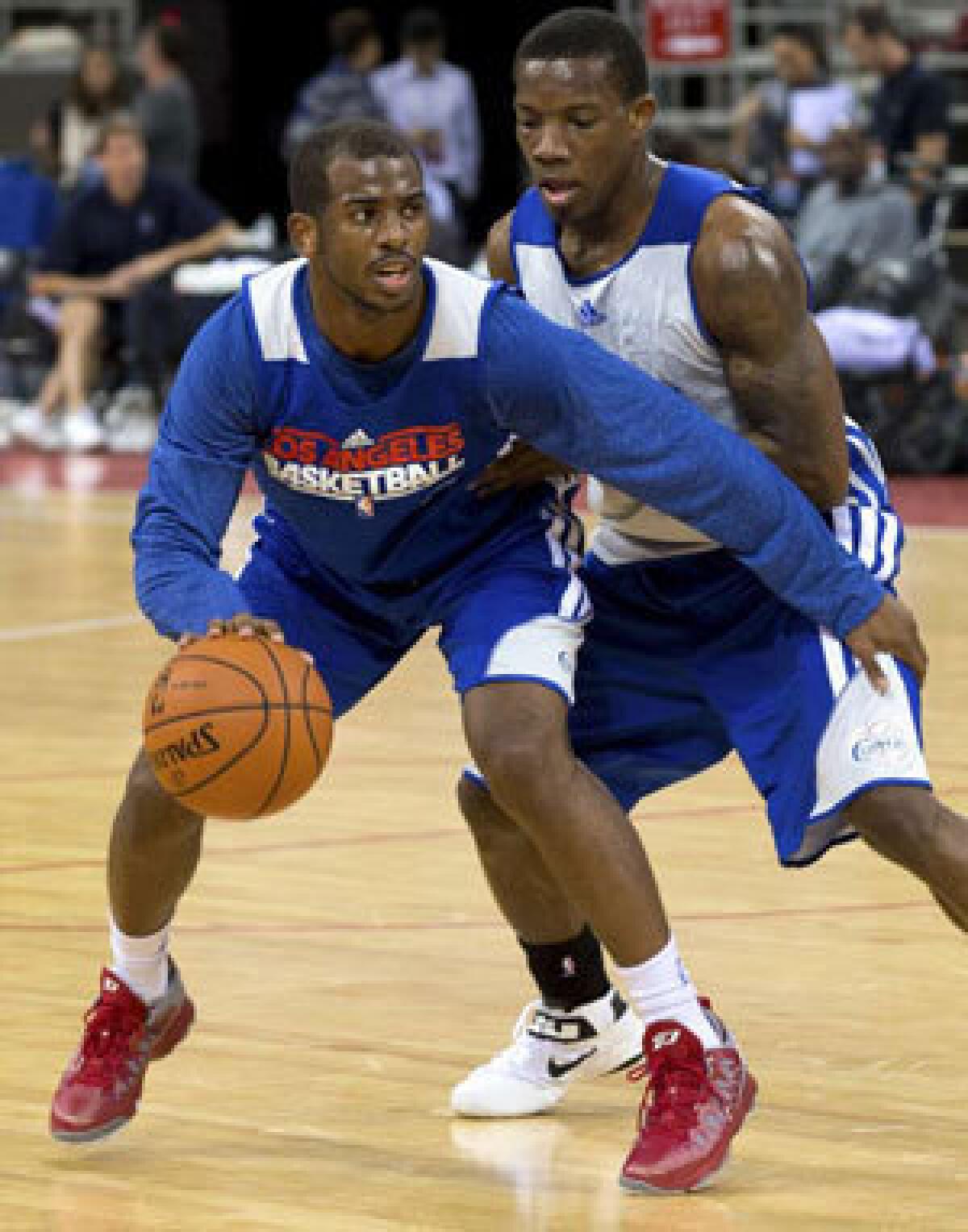 Once teammates, Chris Paul, left, and Eric Bledsoe are on different teams this season.