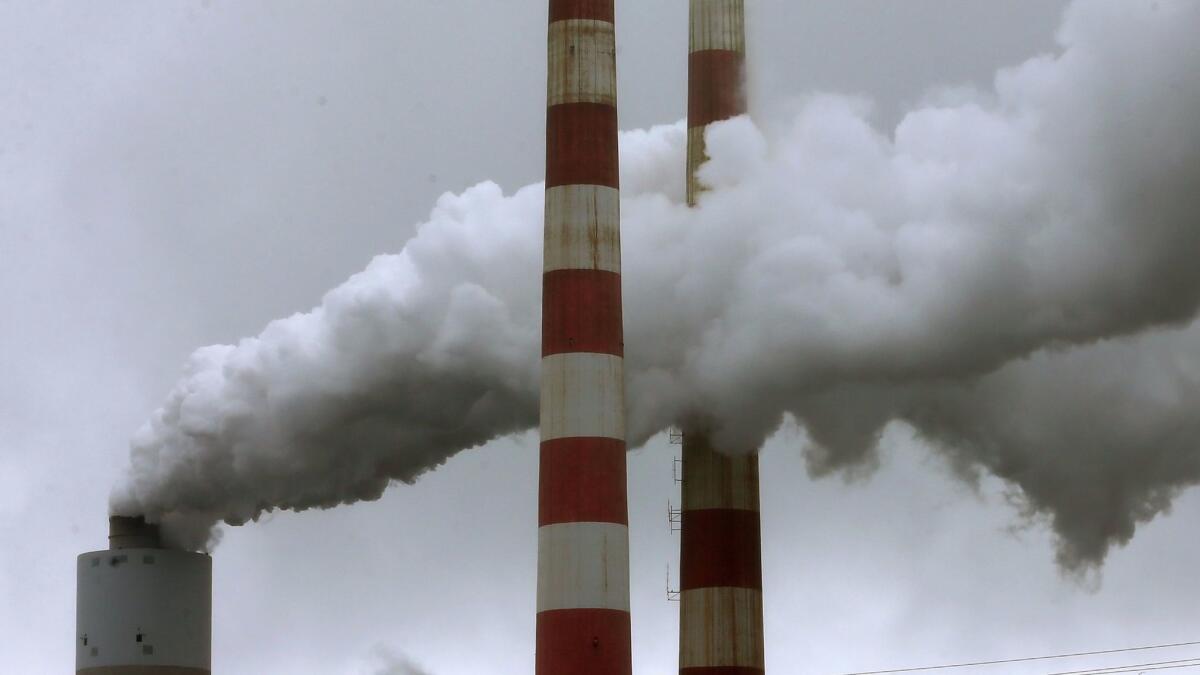 Emissions spew from a large stack at a coal-fired power plant in Newburg, Md. (Mark Wilson / Getty Images)