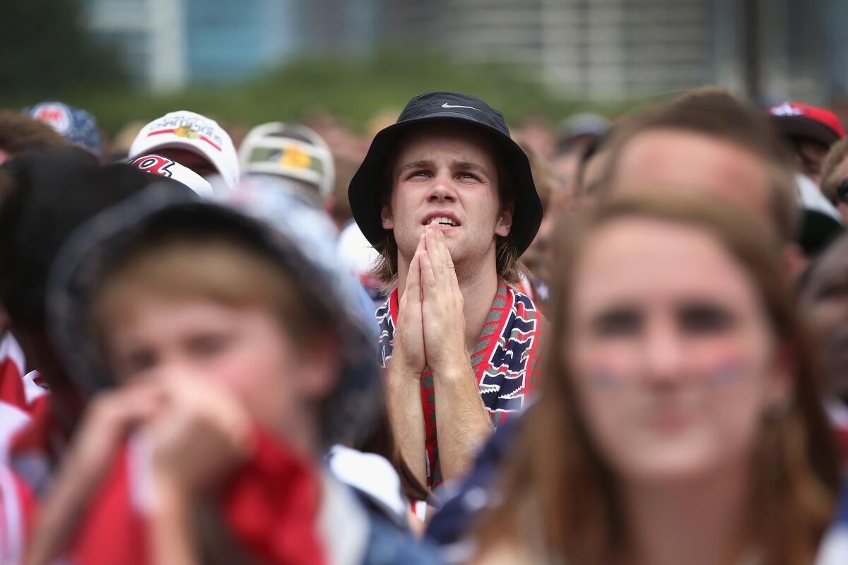 In Chicago, fans watch the U.S. play Germany in World Cup soccer Thursday.
