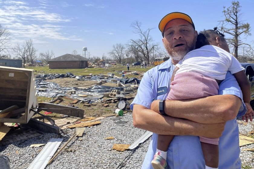 William Barnes talks about the damage to his property on Saturday, March 25, 2023 in Silver City, Miss. Emergency officials in Mississippi say several people have been killed by tornadoes that tore through the state on Friday night, destroying buildings and knocking out power as severe weather produced hail the size of golf balls moved through several southern states. (AP Photo/Michael Goldberg)