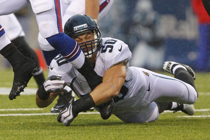 Russell Allen tries to make a tackle as the Jacksonville Jaguars play against the Buffalo Bills.