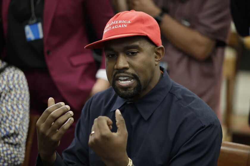 Rapper Kanye West speaks to President Donald Trump and others in the Oval Office of the White House, Thursday, Oct. 11, 2018, in Washington. (AP Photo/Evan Vucci)