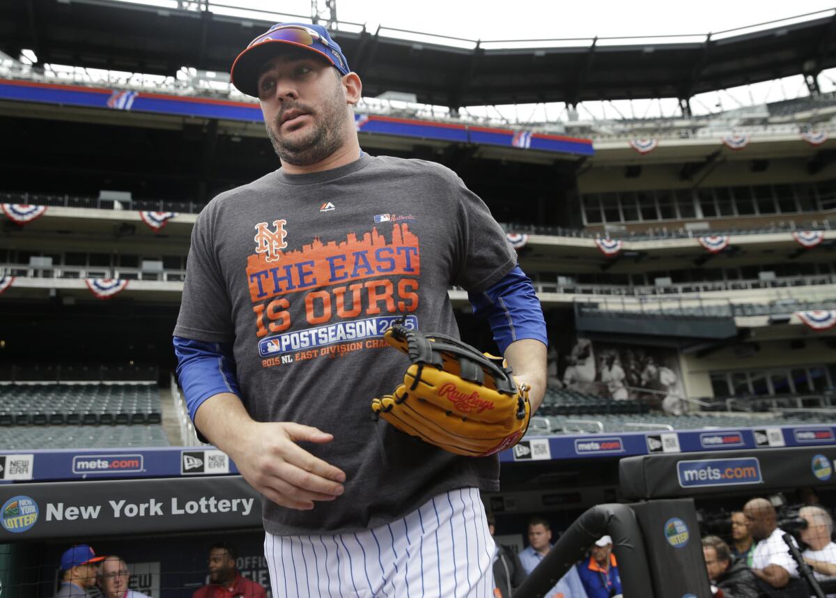 Mets starting pitcher Matt Harvey runs out onto the field before a workout at Citi Field Wednesday in New York.