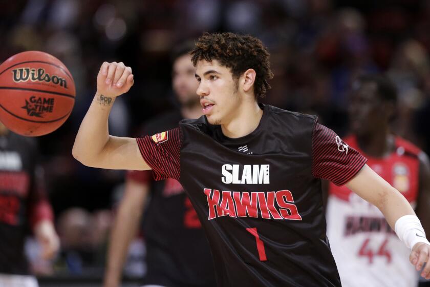 FILE - In this Nov. 17, 2019, file photo, LaMelo Ball of the Illawarra Hawks warms up before their game against the Sydney Kings in the Australian Basketball League in Sydney. LaMelo Ball’s bid to be a club owner in Australia hasn't worked out. The American is expected to be a top pick in the upcoming NBA draft later this year.(AP Photo/Rick Rycroft, File)