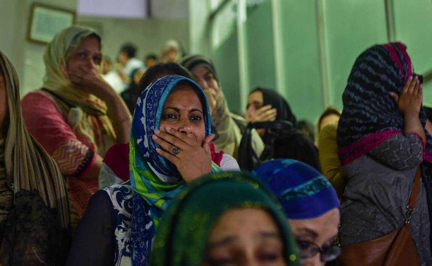 Relatives and friends of two victims of a bloody attack on an upscale restaurant late last week mourn their death during their funeral in Dhaka on July 4, 2016. Relatives of foreign hostages murdered in a Bangladeshi restaurant were in Dhaka on July 4 to take their loved ones' bodies home as authorities made the first arrests over the killings. Many were in tears as Prime Minister Sheikh Hasina laid wreaths on the coffins of those killed in the siege at an upmarket cafe in the capital.