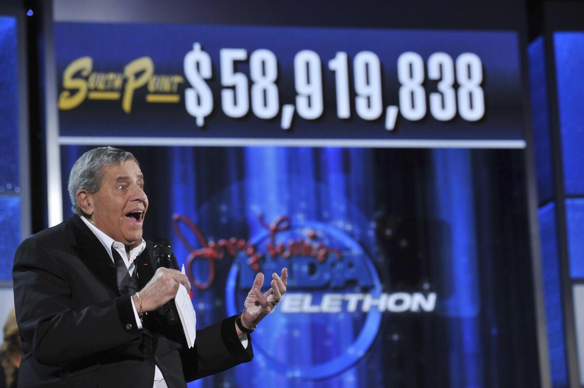 Jerry Lewis announces the amount raised during the MDA Telethon.