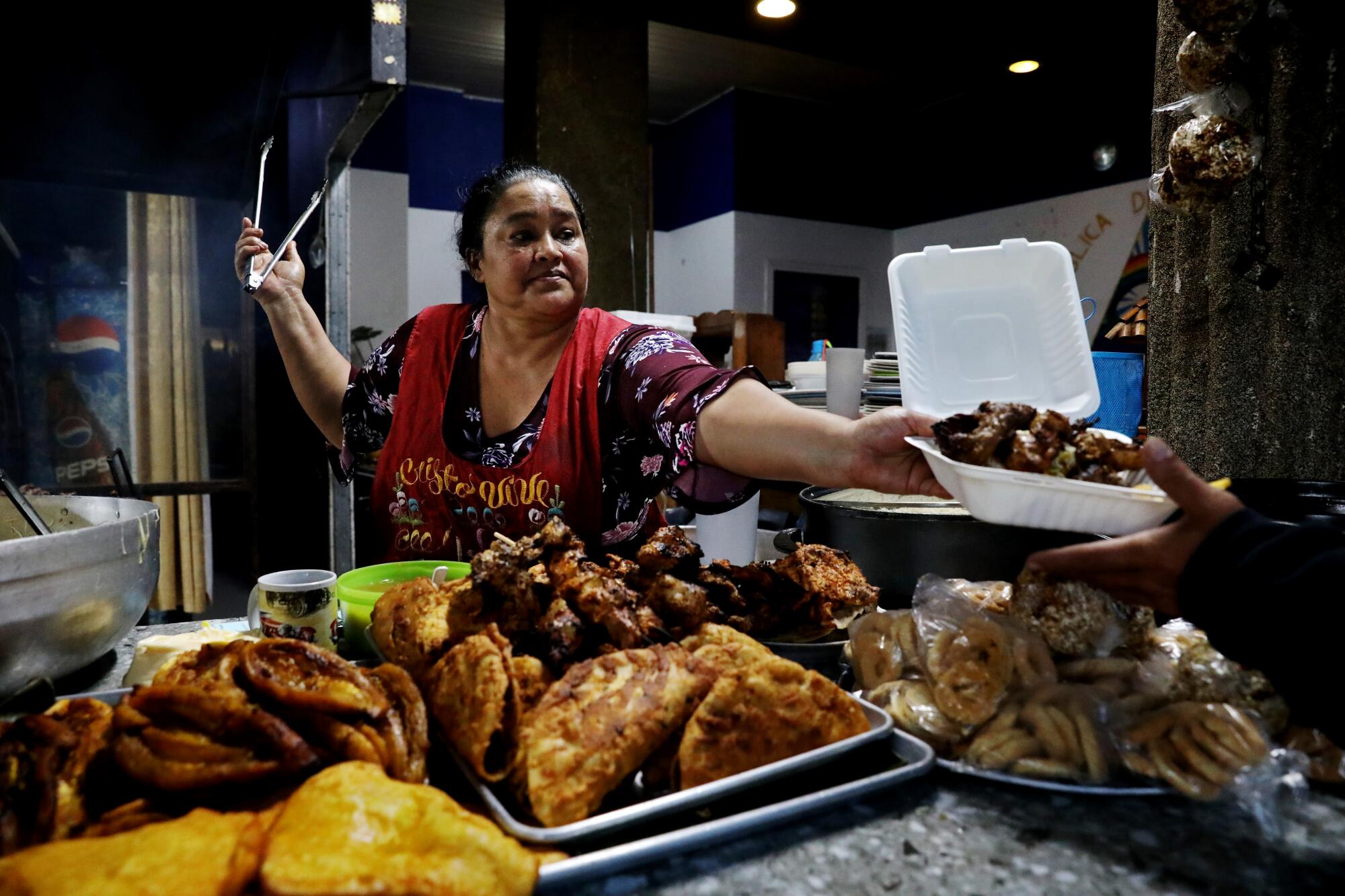 Woman serving food in restaurant