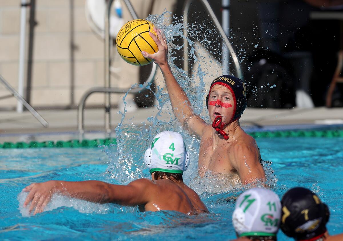 Estancia's Micah Gniffke, top, competes against Costa Mesa during the first half of Wednesday's match.