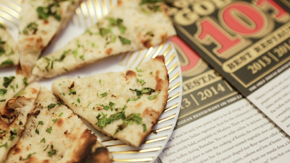 Mayura Indian Restaurant, a Jonathan Gold top 101 pick, features a variety of options like the Naan bread.