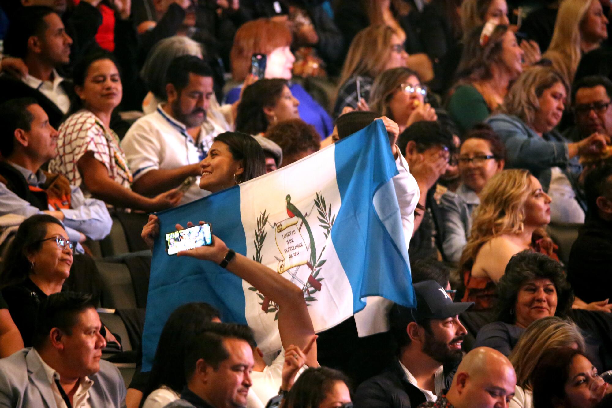 A fan shows off the Guatemala flag before 