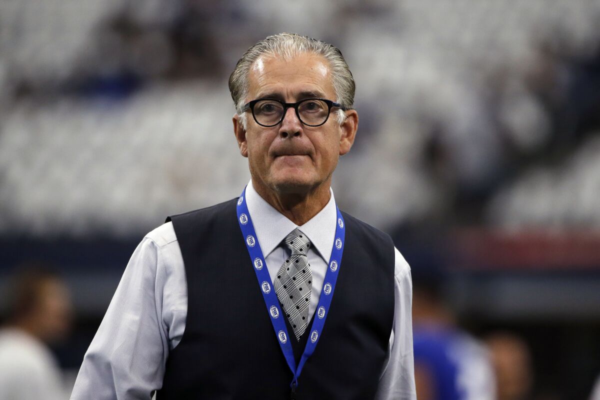 Former NFL official Mike Pereira walks across the field before a game in 2019