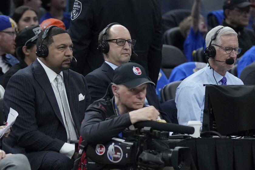 Broadcasters Mark Jackson, Jeff Van Gundy and Mike Breen, from left, during an NBA basketball game between the Golden State Warriors and the Milwaukee Bucks in San Francisco, Saturday, March 11, 2023. (AP Photo/Jeff Chiu)