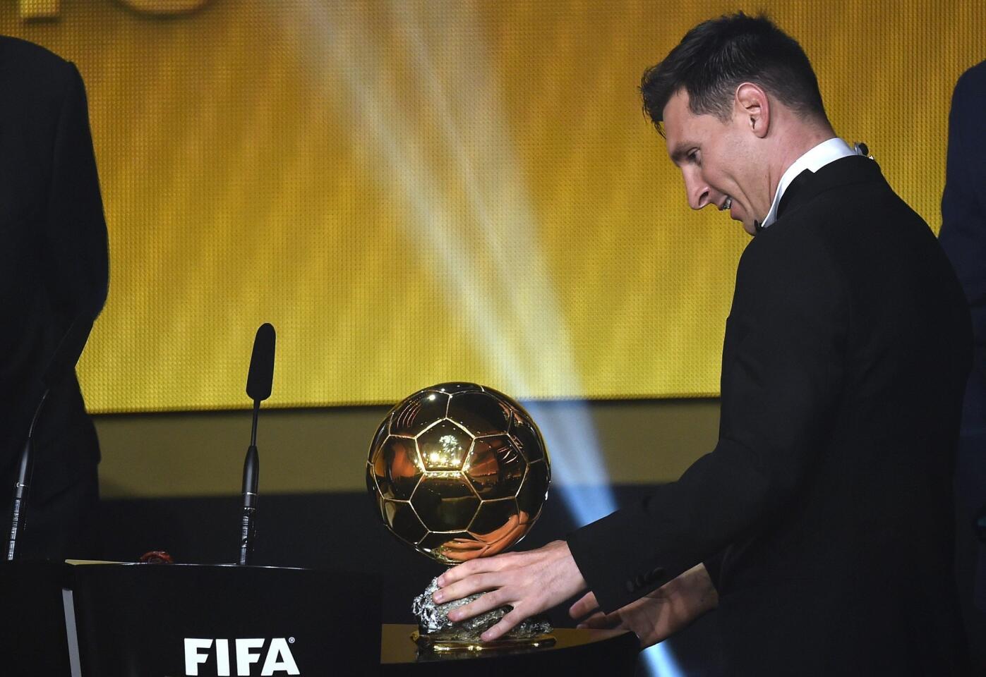 FC Barcelona and Argentina's forward Lionel Messi (C) delivers a speech flanked by FIFA interim president Issa Hayatou (L) and Brazil and Orlando City midfielder Kaka after receiving the 2015 FIFA Ballon dOr award for player of the year during the 2015 FIFA Ballon d'Or award ceremony at the Kongresshaus in Zurich on January 11, 2016. AFP PHOTO / FABRICE COFFRINIFABRICE COFFRINI/AFP/Getty Images ** OUTS - ELSENT, FPG, CM - OUTS * NM, PH, VA if sourced by CT, LA or MoD **