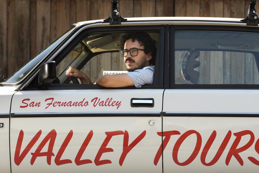 VAN NUYS-CA-AUGUST 7, 2023: Vincent Enrique Hernandez leads super-exclusive "performative" tours, in his Volvo, of the Valley. The off-site tours are part of this year's Hammer Museum biennial. (Christina House / Los Angeles Times)