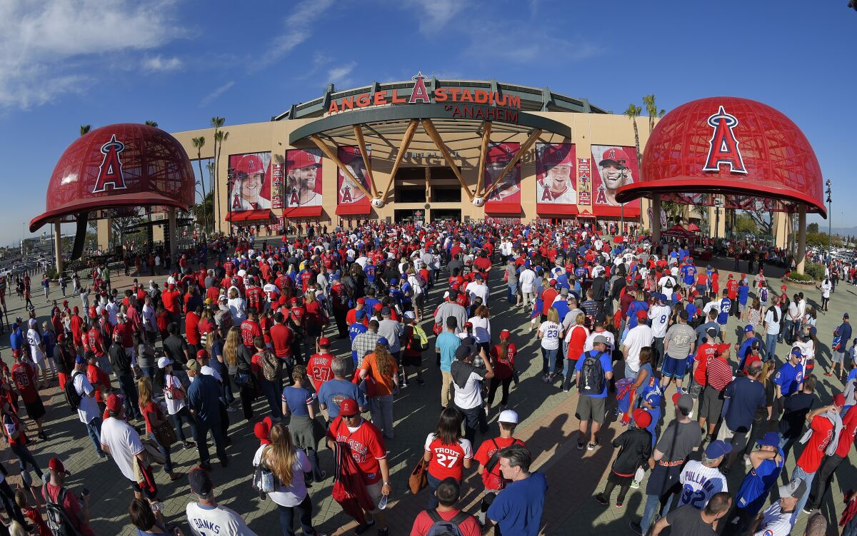a crowd of people outside Angel Stadium