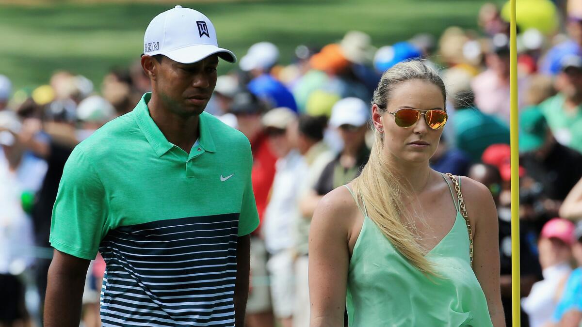 Tiger Woods and Lindsey Vonn appear together at the Masters Par 3 Contest at Georgia's Augusta National Golf Club on April 8.