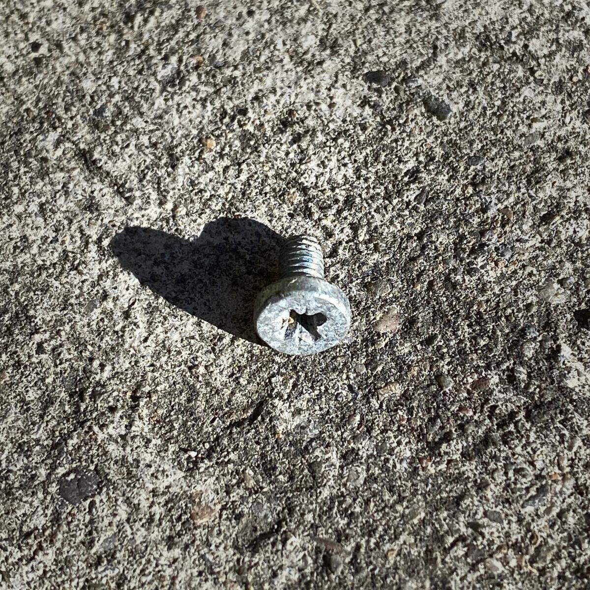 A screw casts a heart-shaped shadow.