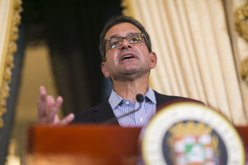 FILE - Puerto Rico's Gov. Pedro Pierluisi speaks during a press conference at La Fortaleza in San Juan, Puerto Rico, Aug. 6, 2019. Pierluisi announced new solar energy initiatives on Tuesday, March 28, 2023, during his annual state of the territory address, a speech viewed by many as critical as he fights plummeting ratings amid growing discontent over costly electric bills, government corruption and slow-moving hurricane reconstruction. (AP Photo/Dennis M. Rivera Pichardo, File)