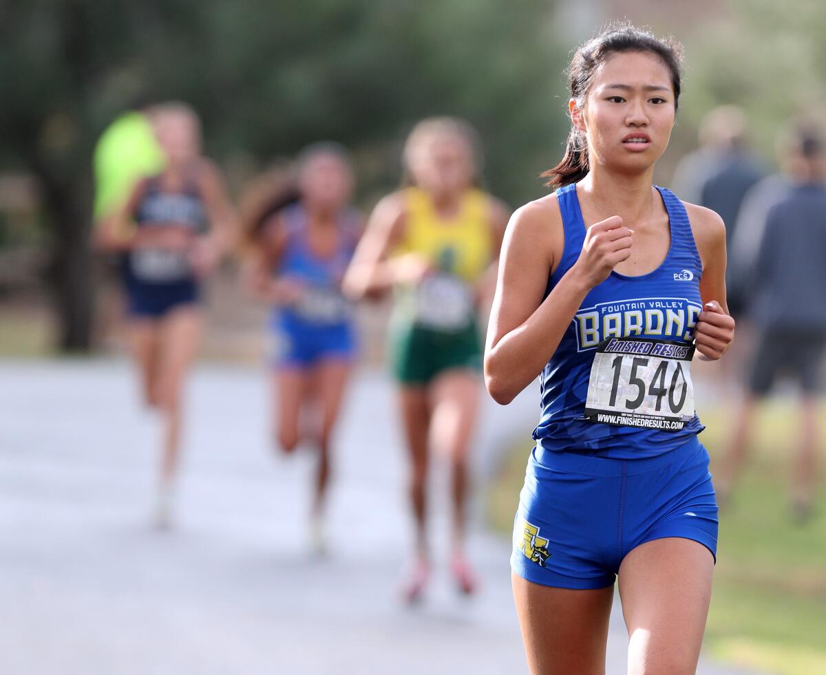 Fountain Valley's Kaho Cichon won the Surf League title in the Sunset Conference cross-country finals at Central Park in Huntington Beach on Saturday.