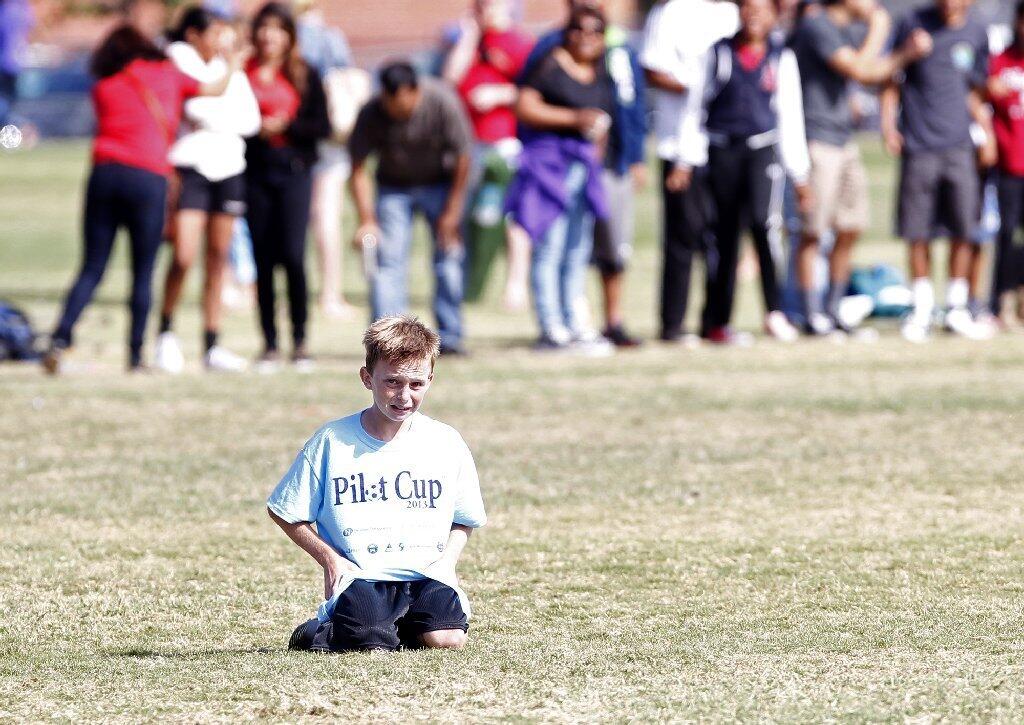 After making an aggresive comeback attempt, a Newport Heights player watches as the final seconds tick away during the Daily Pilot Cup boys' 5-6 gold division championship game Sunday.