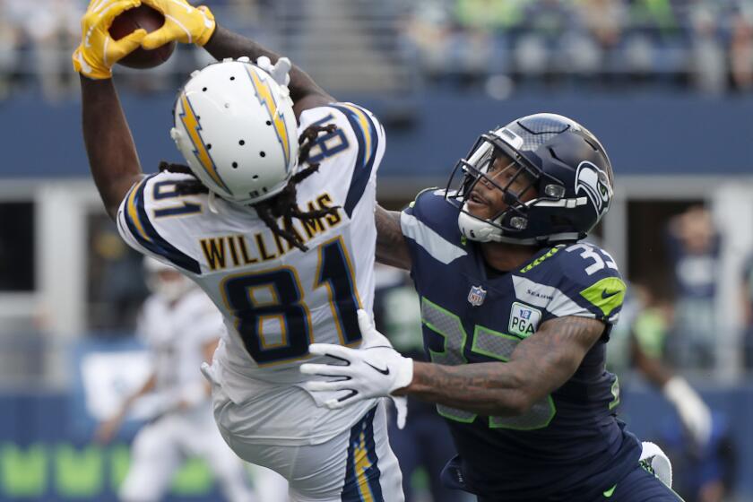 Chargers wide receiver Mike Williams goes up for a pass but can't hold on against Seattle Seahawks safety Derwin James in the second quarter Sunday at Century Link Field in Seattle.