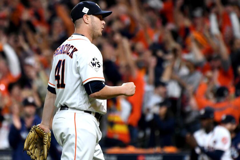 HOUSTON, TEXAS OCTOBER 27, 2017-Astros relief pitcher Brad Peacock pumps his fist after defeating the Dodgers in Game 3 of the World Series at Minute Maid Park in Houston Friday. (Wally Skalij/Los Angeles Times)