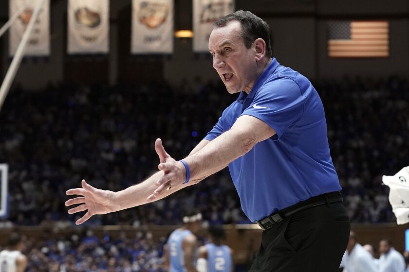 Duke coach Mike Krzyzewski directs the team during the second half of an NCAA.