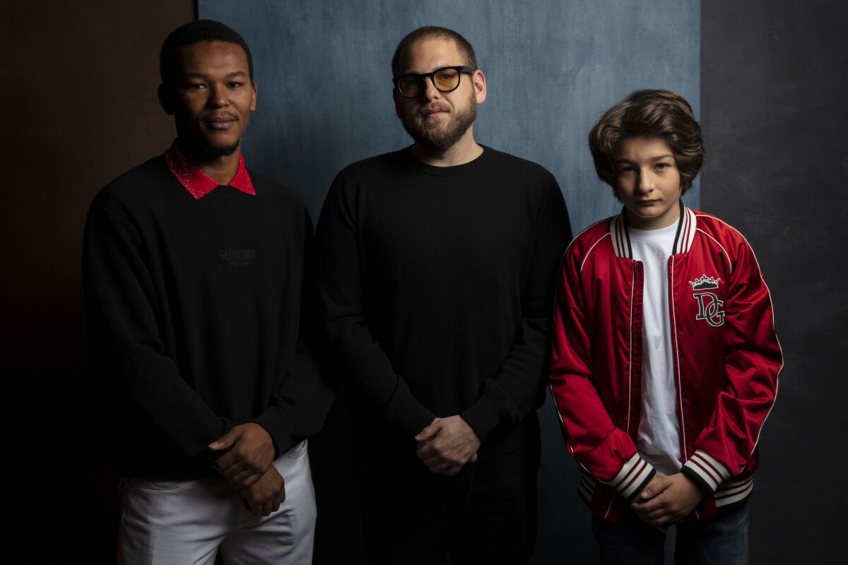Actor Na-Kel Smith, writer/director Jonah Hill and actor Sunny Suljic from the film "Mid90s."