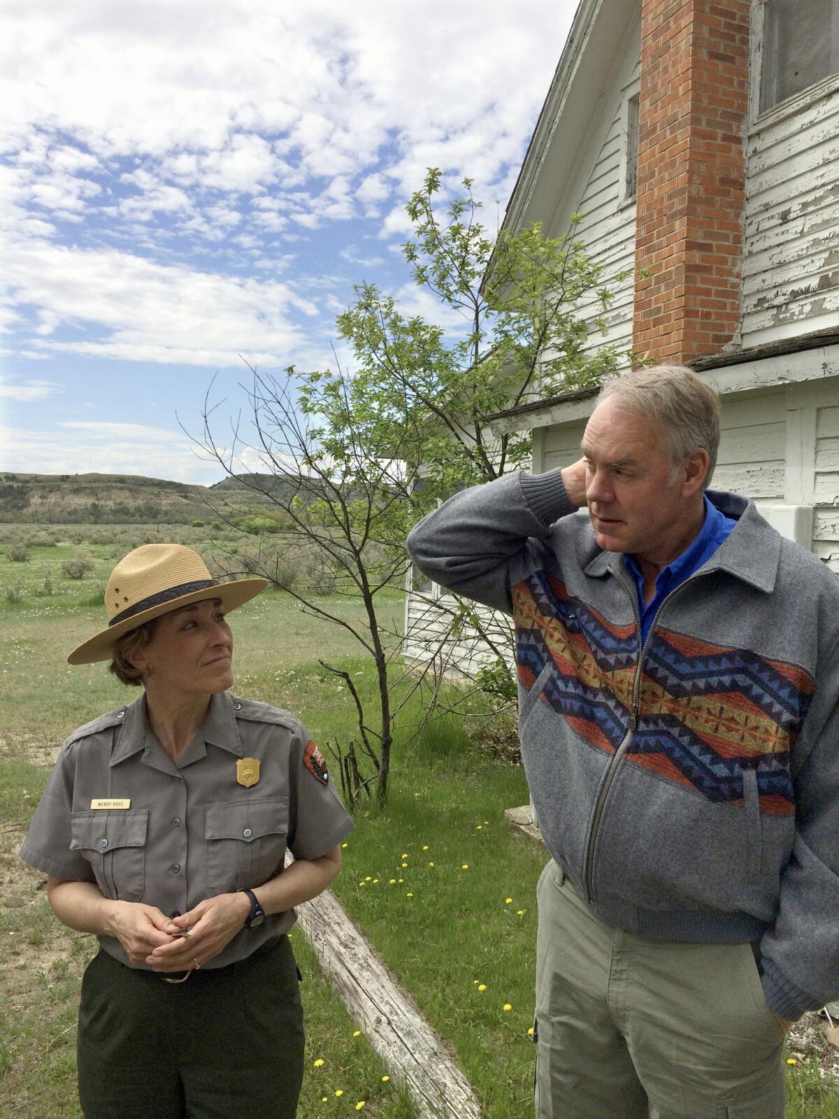 Interior Secretary Ryan Zinke speaks with Theodore Roosevelt National Park Supt. Wendy Ross on Tuesday.