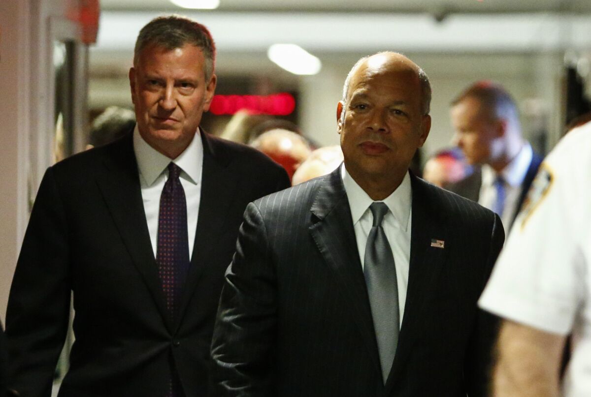 Mayor Bill de Blasio and Secretary of Homeland Security Jeh Johnson before a press conference on the recent police shootings across the country at One Police Plaza on July 8, 2016 in New York City.