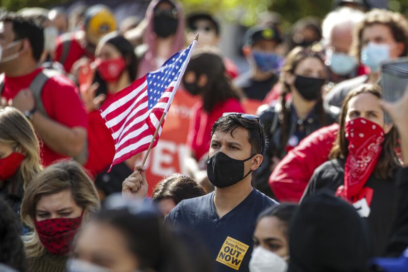 LOS ANGELES, CA - NOVEMBER 07: A protest turned into celebration of Biden / Harris winning at Pershing Square on Saturday, Nov. 7, 2020 in Los Angeles, CA. (Irfan Khan / Los Angeles Times)