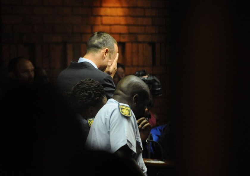 Oscar Pistorius weeps during a court appearance.