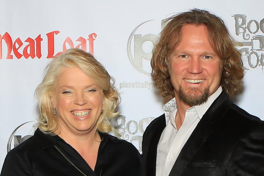 LAS VEGAS, NV - OCTOBER 03: (L-R) Television personalities Janelle Brown, Kody Brown and Christine Brown from "Sister Wives" arrive at the show "RockTellz & CockTails presents Meat Loaf" at Planet Hollywood Resort & Casino on October 3, 2013 in Las Vegas, Nevada. (Photo by Gabe Ginsberg/FilmMagic)