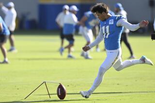 The Chargers' Cameron Dicker practices kicking field goals during camp.