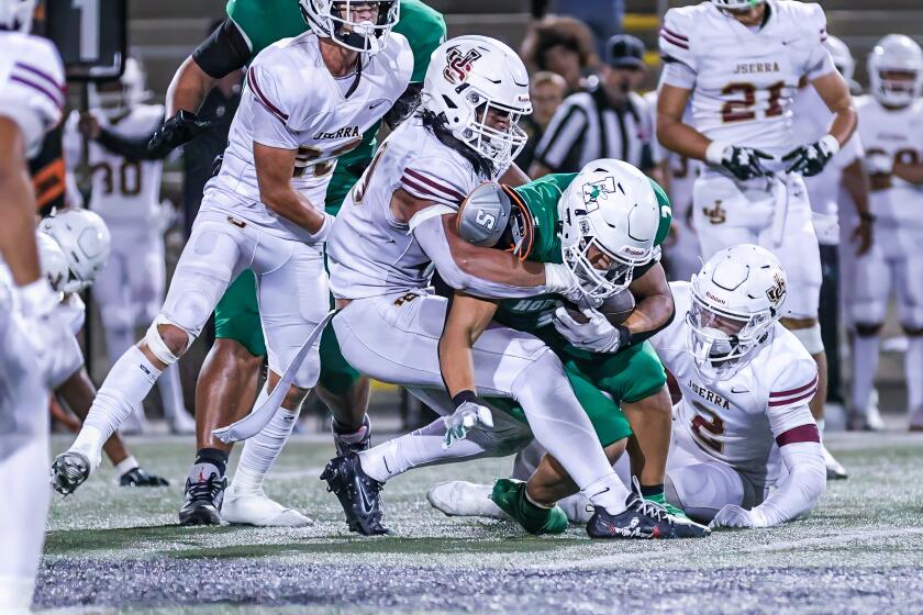 Linebacker Madden Faraimo of JSerra takes down a San Diego Lincoln ballcarrier in 28-19 victory.