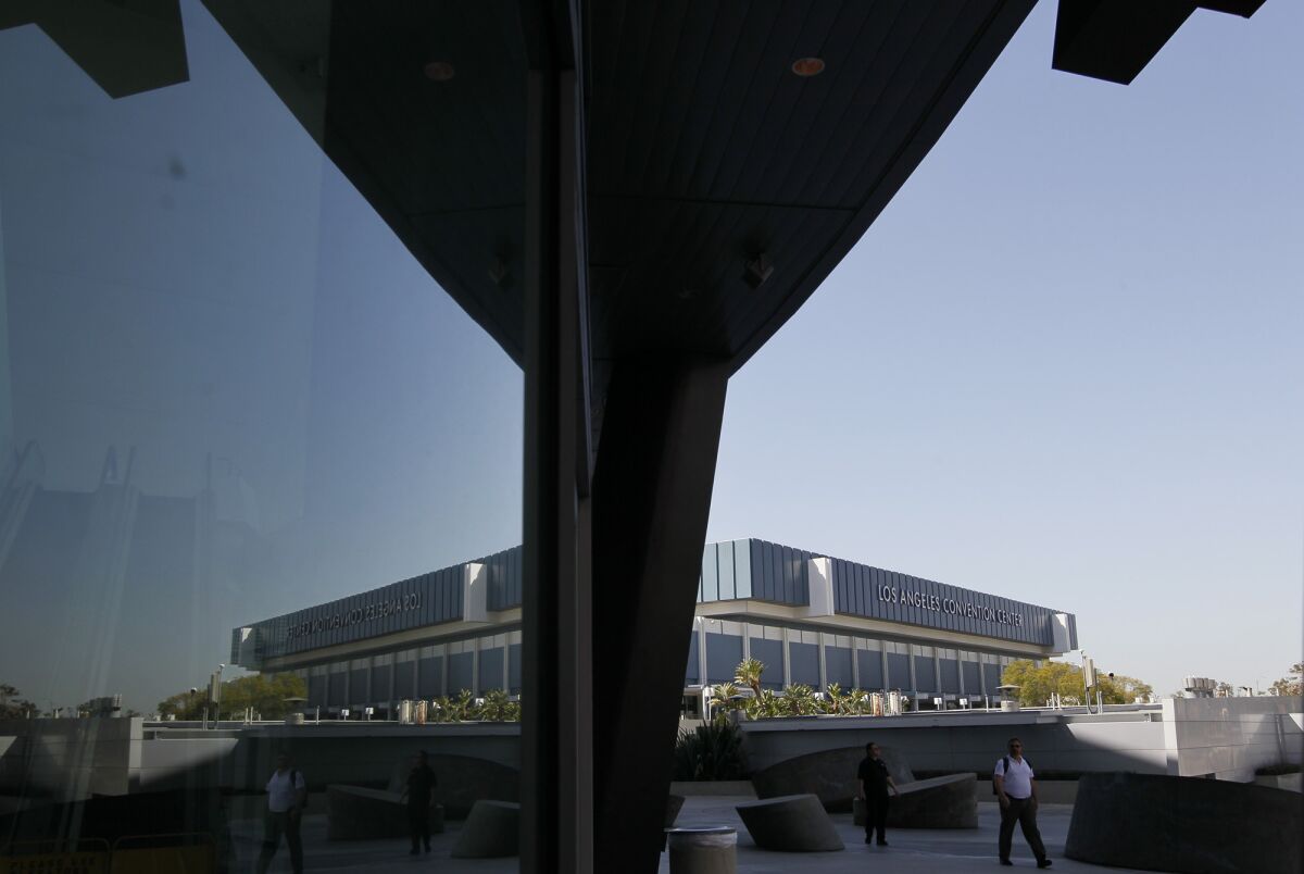 The World Wide Art Fair, held at the L.A. Convention Center, drew smaller-than-anticipated attendance and generated artist criticisms of poor management. Here, the Convention Center building can be seen reflected on the Staples Center across the street.