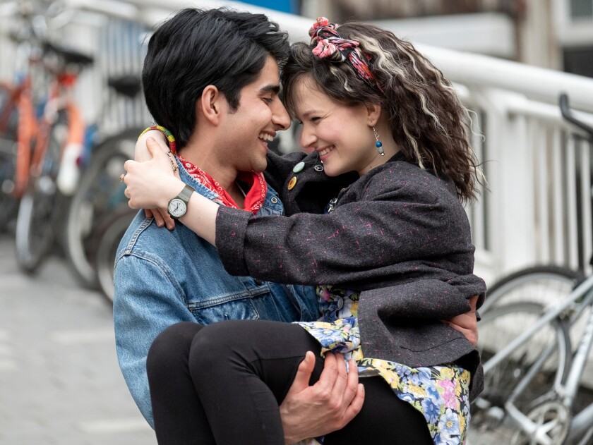 Viveik Kalra holds Nell Williams in his arms in “Blinded by the Light.”