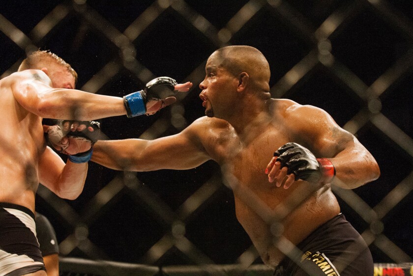 UFC light-heavyweight champion Daniel Cormier lands a punch against challenger Alexander Gustafsson during their bout at UFC 192 in Houston on Saturday night.