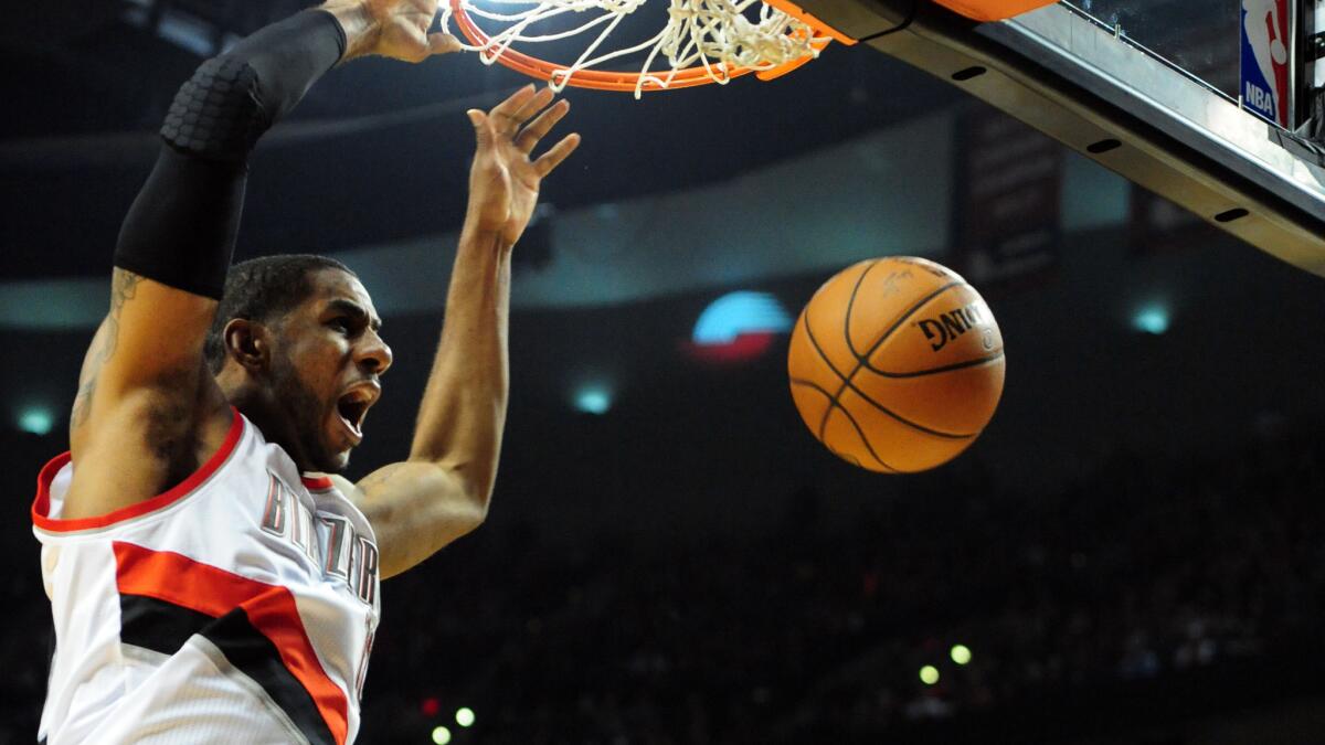 Portland Trail Blazers forward LaMarcus Aldridge dunks during a playoff game against the Houston Rockets in April 2014. Aldridge announced Saturday he will sign with the San Antonio Spurs.