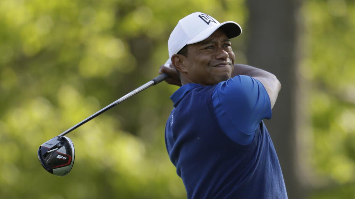 Tiger Woods hits a drive off the 13th tee during the first round of the PGA Championship golf tournament, Thursday, May 16, 2019, at Bethpage Black in Farmingdale, N.Y. (AP Photo/Julio Cortez)